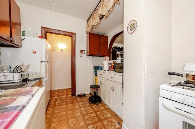 kitchen with white gas range