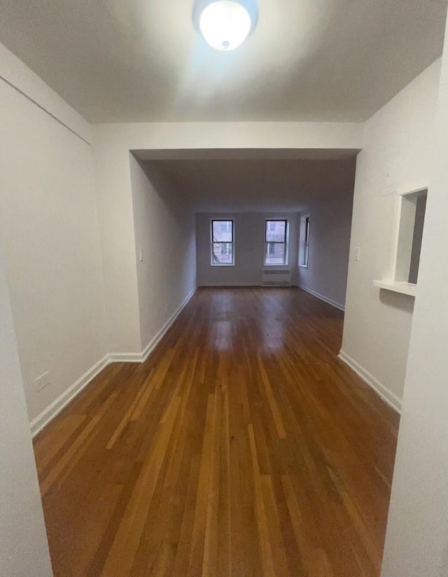 bonus room with dark wood-type flooring