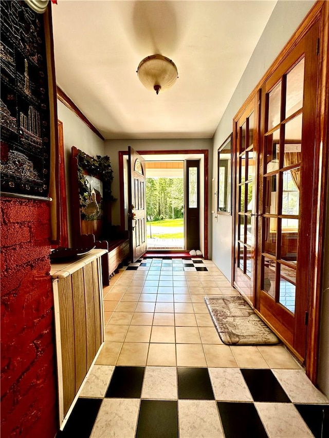 doorway featuring french doors and ornamental molding