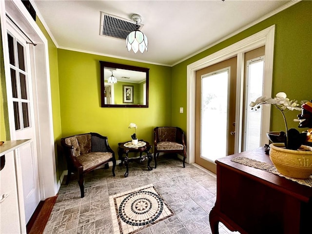 sitting room featuring crown molding