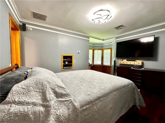 bedroom with crown molding