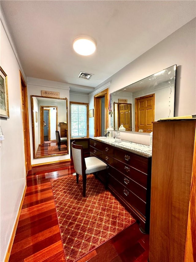 bathroom featuring hardwood / wood-style floors and vanity