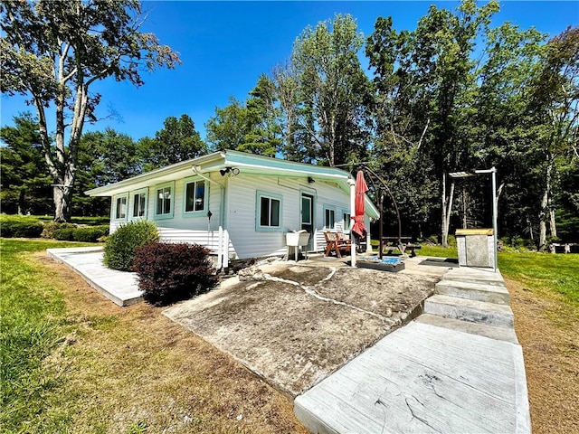 exterior space featuring a patio and a front yard