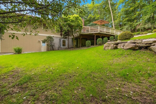 view of yard with a wooden deck