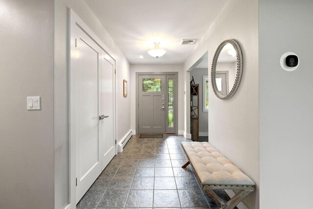 entryway with a baseboard radiator