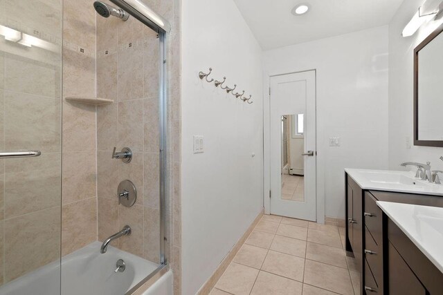 bathroom featuring tile patterned floors, shower / bath combination with glass door, and vanity