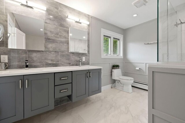 bathroom with vanity, a baseboard radiator, and toilet