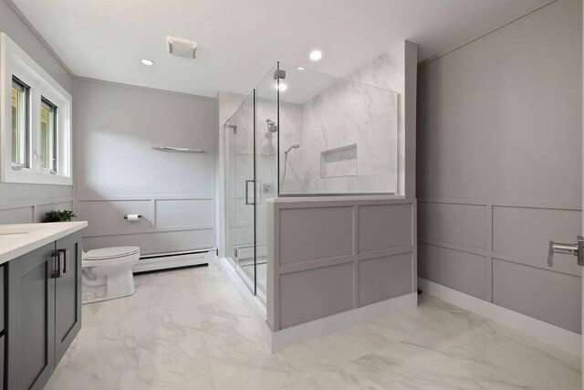 bathroom with vanity, toilet, an enclosed shower, and a baseboard heating unit