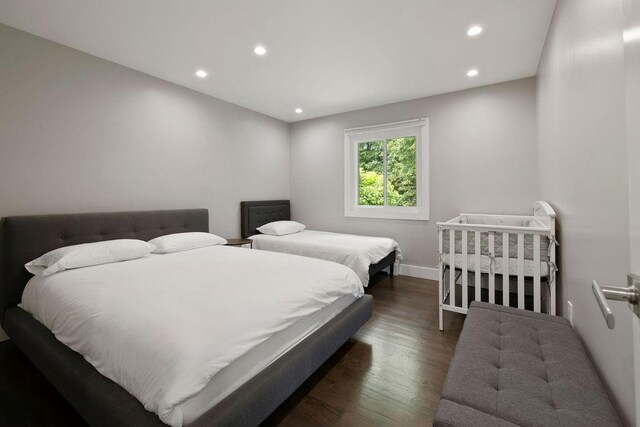 bedroom featuring dark wood-type flooring