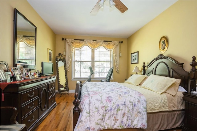 bedroom featuring ceiling fan and light hardwood / wood-style flooring