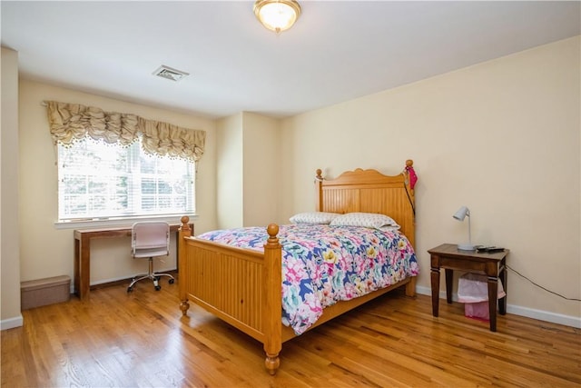 bedroom featuring hardwood / wood-style flooring