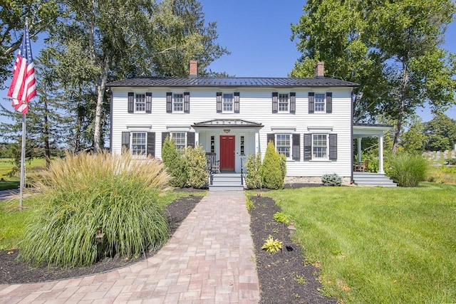 colonial inspired home with a front yard