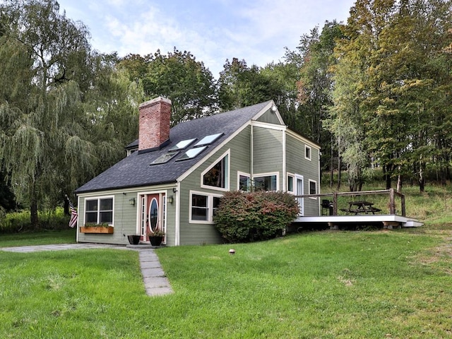 view of front of house featuring a deck and a front lawn