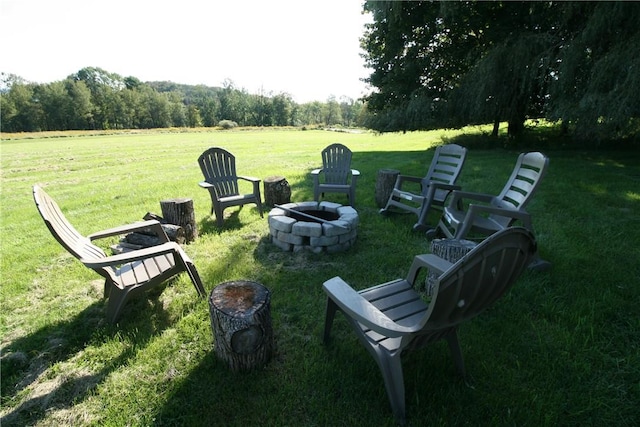 view of yard with an outdoor fire pit