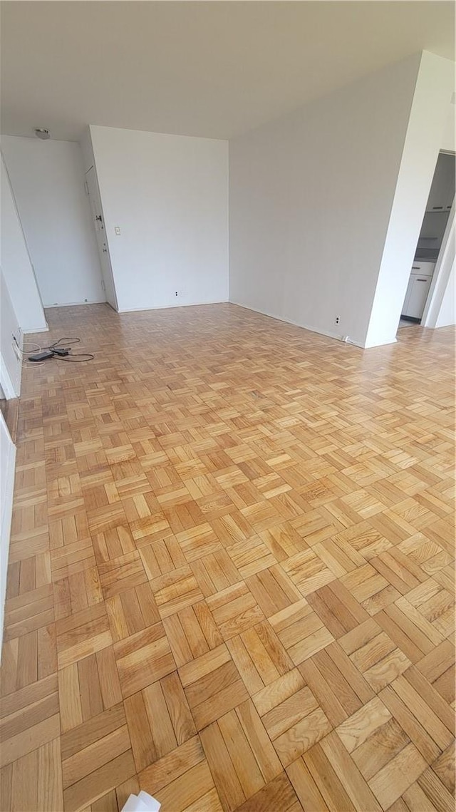 spare room featuring light parquet floors