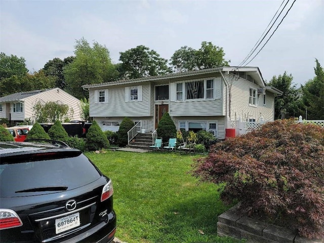 bi-level home featuring a front yard