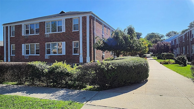 view of property exterior with brick siding