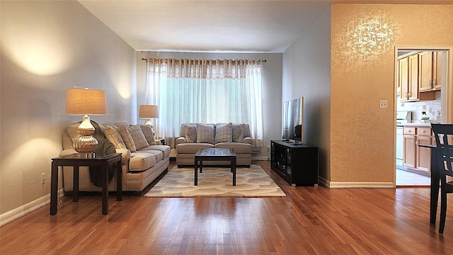 living room with wood finished floors and baseboards