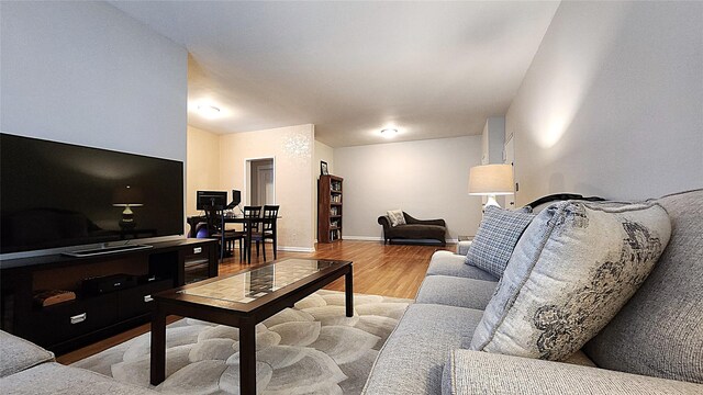 living room with wood finished floors and baseboards