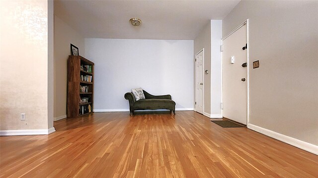 sitting room with light wood-style floors and baseboards