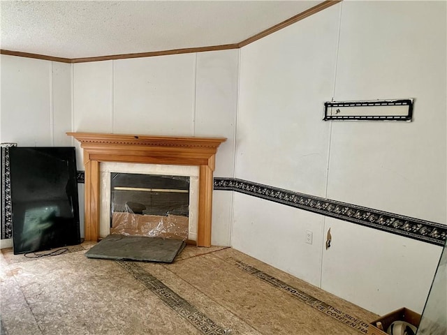 interior details featuring black fridge, crown molding, and a textured ceiling