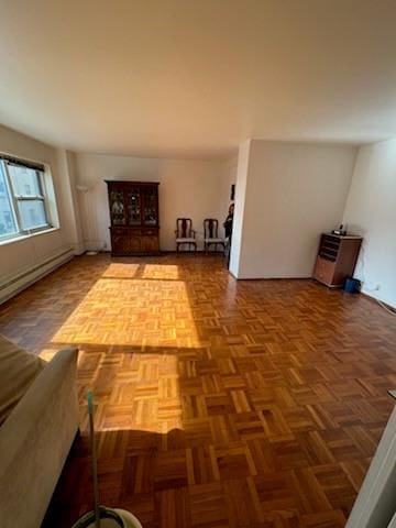 6 Fordham Hill Oval Unit 2D, Bronx, NY 10468 - unfurnished living room with baseboard heating