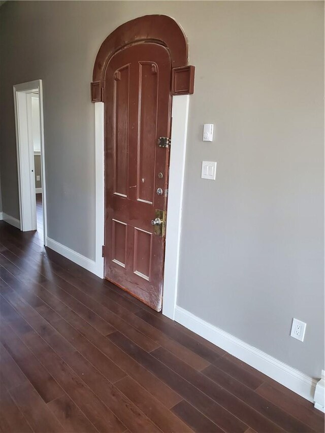 entryway with dark wood-type flooring