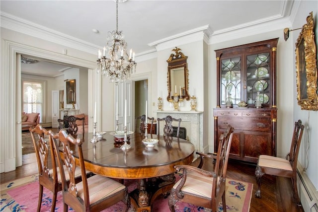 dining room with baseboard heating, dark hardwood / wood-style flooring, an inviting chandelier, and ornamental molding