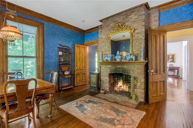 4 Deer Run, Sparkill, NY 10976 - sitting room featuring hardwood / wood-style flooring, a chandelier, crown molding, and a brick fireplace
