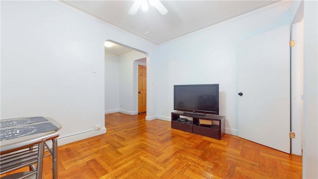 2191 Bolton St Unit 5E, Bronx, NY 10462 - living room featuring arched walkways, crown molding, ceiling fan, and baseboards