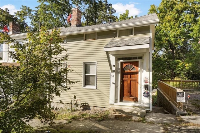 view of front of house with a chimney