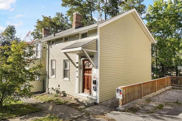 view of side of property featuring a chimney