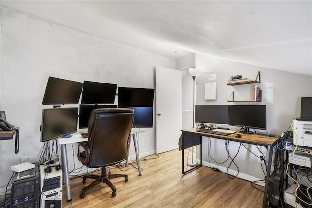 office featuring baseboards and wood finished floors