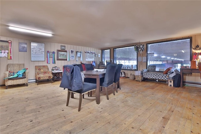 dining room featuring light wood-type flooring and a baseboard radiator