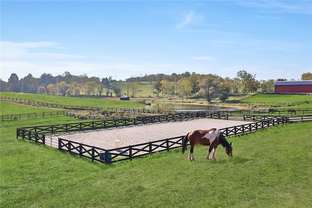 surrounding community with a rural view and a water view