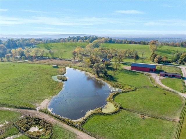 birds eye view of property featuring a water view and a rural view