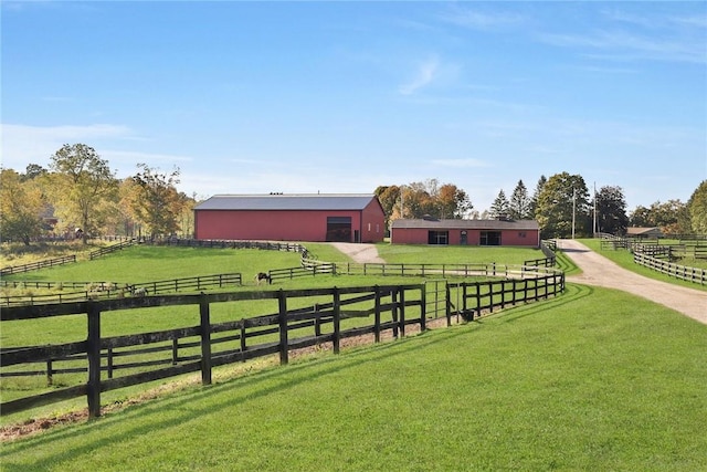 exterior space with a rural view and an outdoor structure