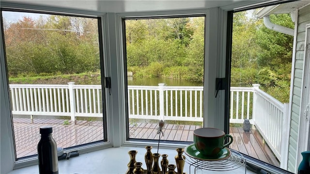 doorway to outside featuring a water view