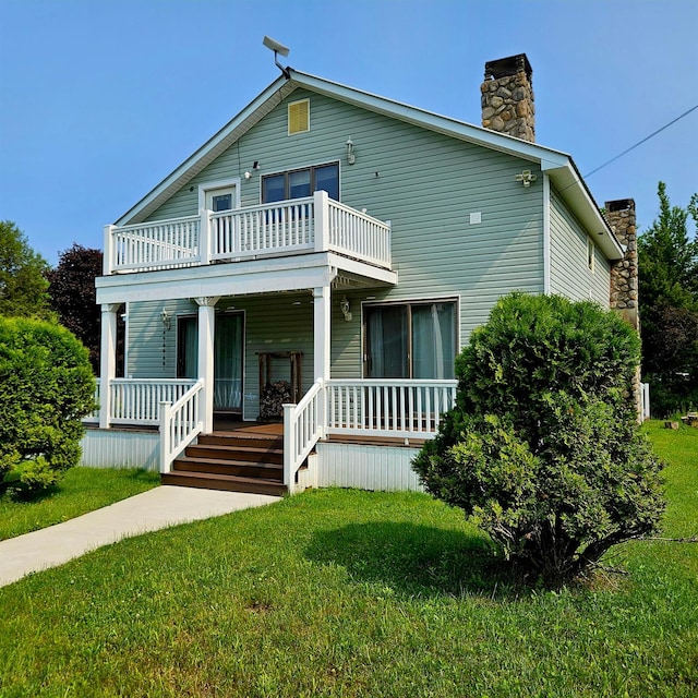 141 Bonnie Brook Rd, Roscoe, NY 12776 - view of front of home with a balcony, a porch, a chimney, and a front yard