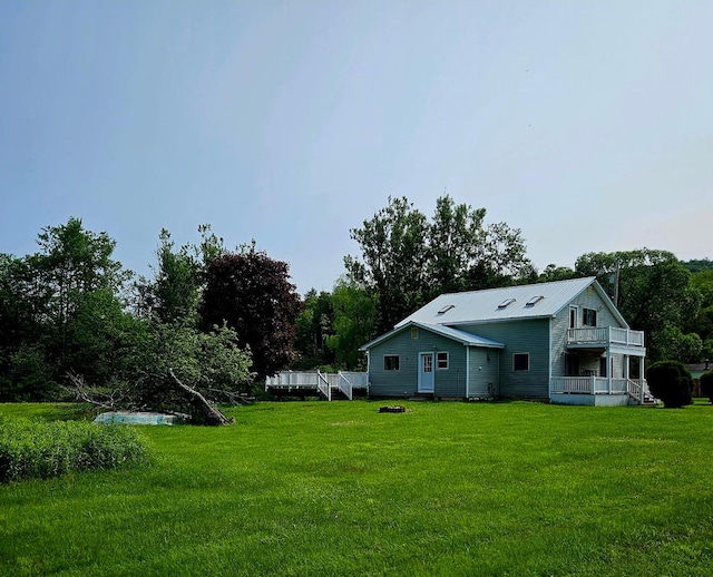 141 Bonnie Brook Rd, Roscoe, NY 12776 - view of grassy yard with a balcony and view of wooded area