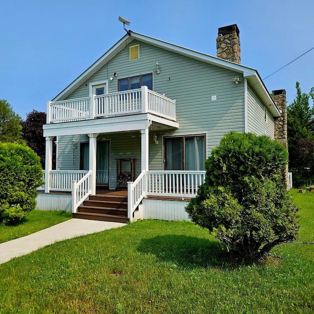 141 Bonnie Brook Rd, Roscoe, NY 12776 - view of front of property with a balcony, a porch, a chimney, and a front lawn