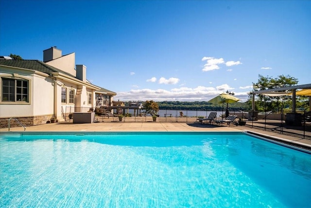 view of swimming pool with a patio area