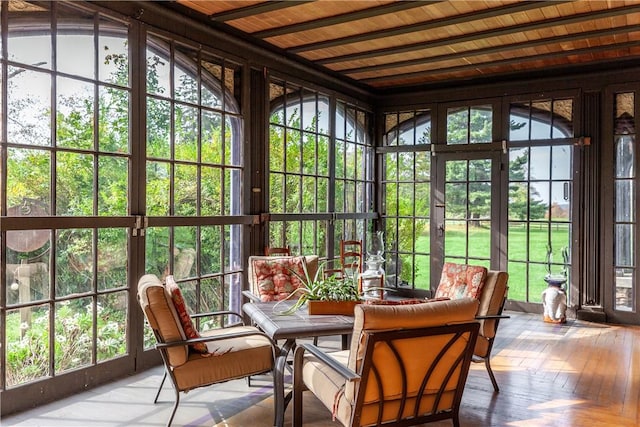 sunroom with a wealth of natural light, lofted ceiling, and wood ceiling