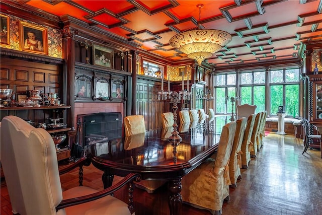 dining room featuring a fireplace, parquet floors, and crown molding