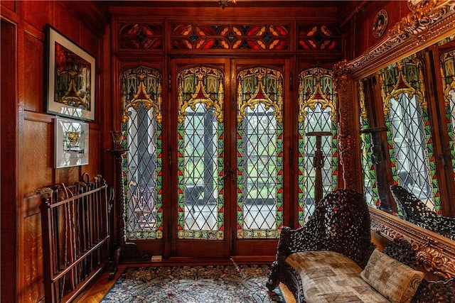 foyer entrance with a wealth of natural light and wood walls