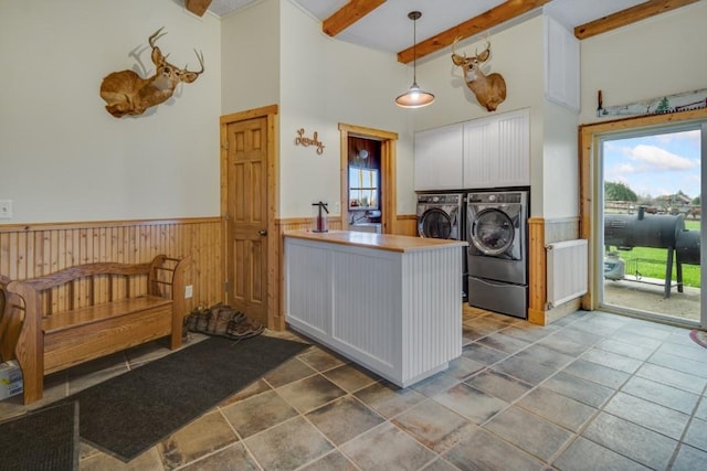 kitchen with white cabinets, beam ceiling, decorative light fixtures, and independent washer and dryer