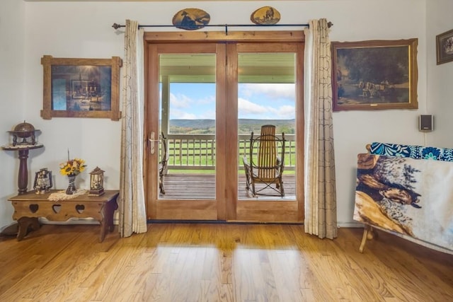 doorway with light wood-type flooring