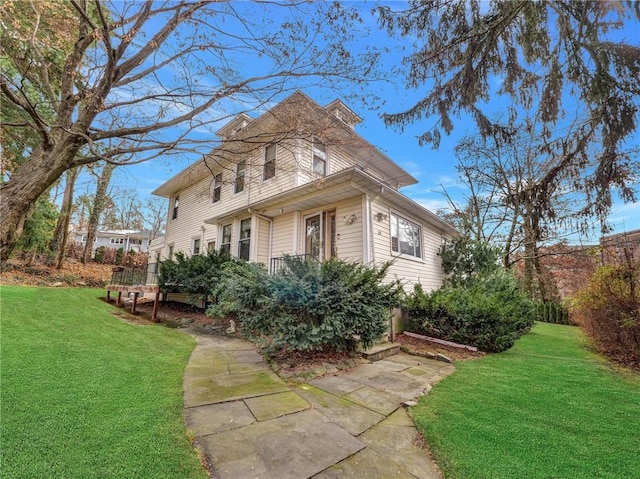 view of home's exterior featuring a yard