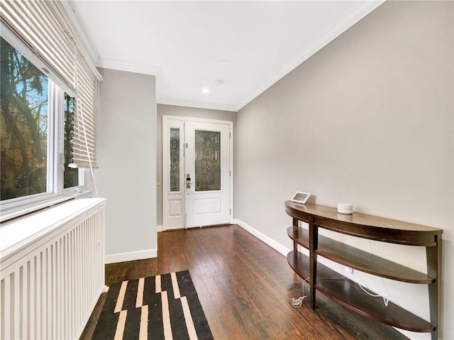 10 Columbia Ave, Hartsdale, NY 10530 - entrance foyer featuring wood finished floors, baseboards, radiator heating unit, and crown molding