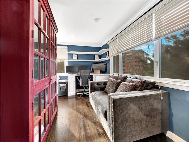 living room featuring dark hardwood / wood-style flooring and ornamental molding